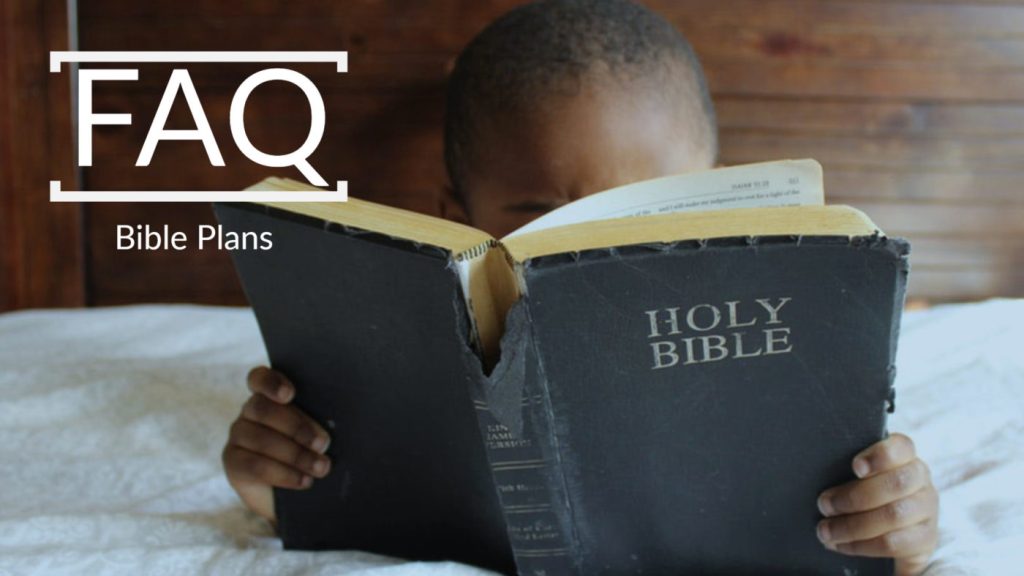 Image of young boy reading Bible