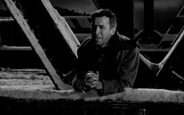 Man on bridge in despair